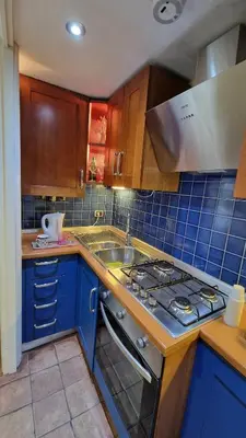 a kitchen with a stove and a sink at Re di Roma vacation in Rome