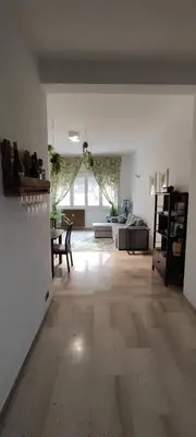 a large white room with a living room and a couch at Casa con Lorenzo in Rome