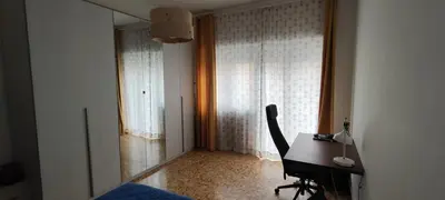 a bedroom with a desk and a bed and a window at Casa con Lorenzo in Rome