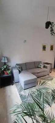 a living room with a couch and a rug at Casa con Lorenzo in Rome