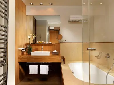 a bathroom with a tub and a sink and a shower at Margutta 54 Luxury Suites in Rome