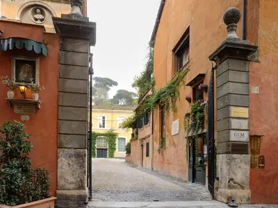 an alley in an old town with buildings at Margutta 54 Luxury Suites in Rome
