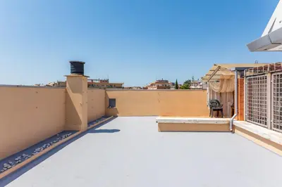 a room with two washing machines in a white wall at Balduina Home in Rome