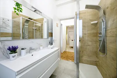 a bathroom with a sink and a shower at 3 Passi Da Metro Marconi- 8 min Colosseo in Rome