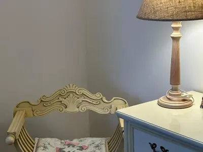 a lamp sitting next to a crib next to a table at Sophia Luxury Home confortevole e in ottima posizione in Rome