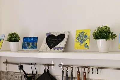 a shelf with plants and cards on it at La Casina di Luigi con balcone in Rome