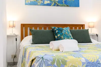 a bedroom with a bed with two towels on it at La Casina di Luigi con balcone in Rome