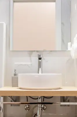 a bathroom with a sink and a mirror at Bottega Artistica Guest House in Rome