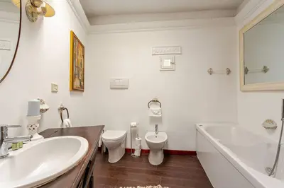 a bathroom with a tub and a toilet and a sink at Fontana di Trevi a 2 passi in Rome