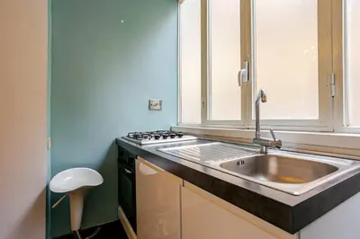 a kitchen with a sink and a stove at Fontana di Trevi a 2 passi in Rome