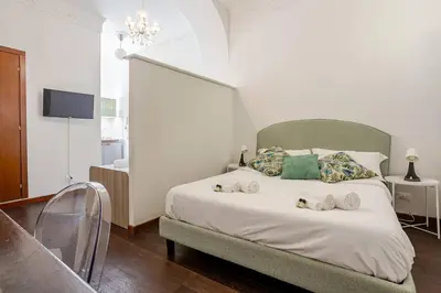 a bedroom with a bed with towels on it at Fontana di Trevi a 2 passi in Rome