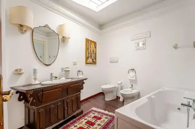 a bathroom with a tub and a sink and a toilet at Fontana di Trevi a 2 passi in Rome