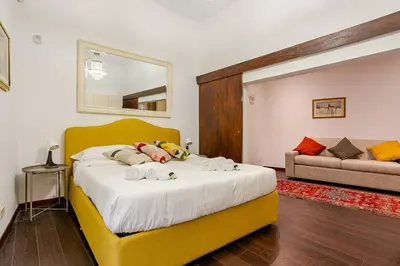 a bedroom with a bed with stuffed animals on it at Fontana di Trevi a 2 passi in Rome