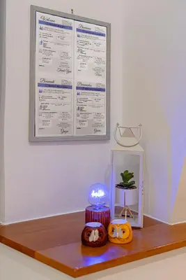 a table with two cakes and a menu on the wall at casa cavour in Rome