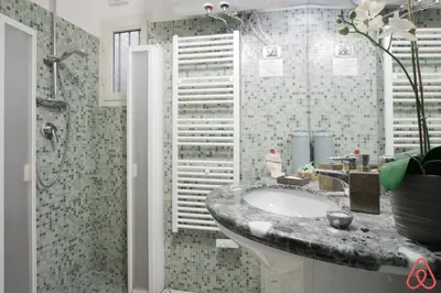 a bathroom with a sink and a shower at Your nest in Trastevere, the heart of Rome - Il vostro Nido nel cuore di Roma in Rome