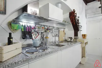 a kitchen with a sink and a counter top at Your nest in Trastevere, the heart of Rome - Il vostro Nido nel cuore di Roma in Rome