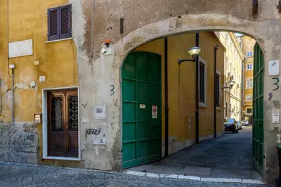 an entrance to a building with a green door at Puccini Flat in Rome