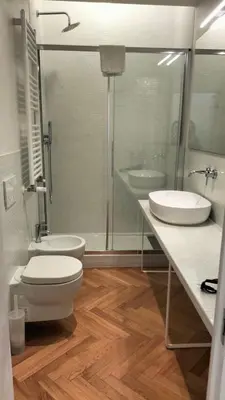 a bathroom with a toilet and a sink and a shower at Catone 34 in Rome