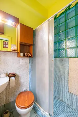 a bathroom with a shower with a toilet and a sink at Fine Art House in Rome