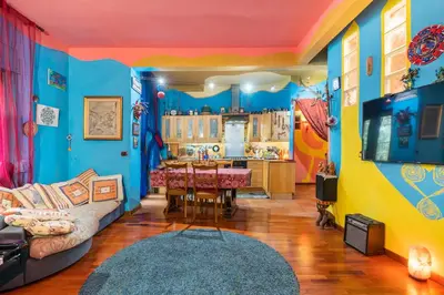 a living room with a couch and a table at Fine Art House in Rome