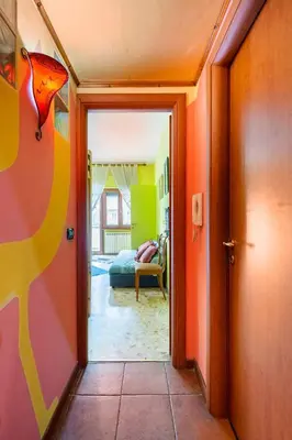 a hallway with a door leading to a bedroom at Fine Art House in Rome