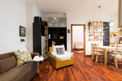 a living room with a couch and a table at Design Apartment close to Trastevere in Rome