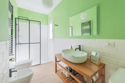 a bathroom with a sink and a toilet and a mirror at Maison Rinascimento Roma in Rome