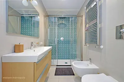a bathroom with a sink and a toilet and a shower at Casa Magnifica in Rome