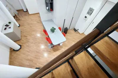 an overhead view of a living room with a table and chairs at Trevi Suite Apartment - Barberini in Rome