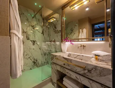 a bathroom with a marble sink and a shower at Pantheon Suite - Residenze di Charme in Rome