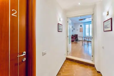 a hallway with a door leading to a living room at MICLAD Colosseum Guest House in Rome