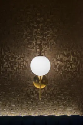 a light hanging from a wall with a ceiling at Bocca di Leone Luxury Suite in Rome