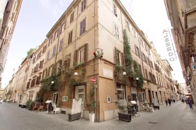 a large building on a street with plants on it at Silver Spanish's steps in Rome