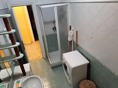a small bathroom with a shower and a toilet at Casa Caselli in Rome