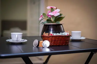 a table with a basket with a flower in a vase at Pantheon Charming by Varental in Rome