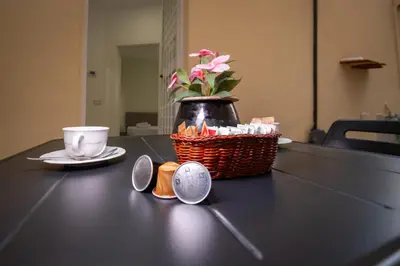 a black table with a basket and a cup and a plate at Pantheon Charming by Varental in Rome