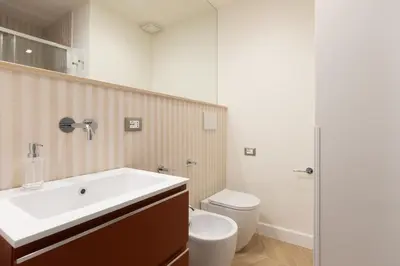 a bathroom with a sink and a toilet at Residenza Foraggi 83 in Rome