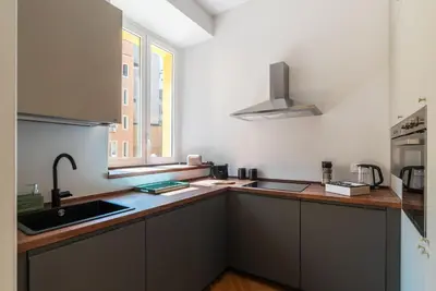 a kitchen with a sink and a window at GuestHost - Rione Prati Apartments in Rome