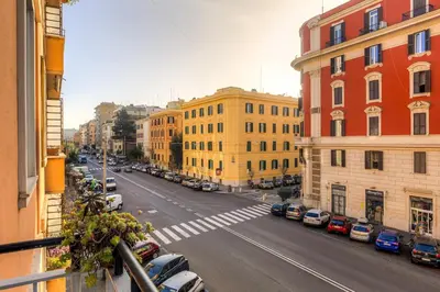 a view of a city street with parked cars at Giuliana Apartment Vatican in Rome