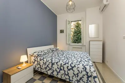 a bedroom with a bed and a window at Giuliana Apartment Vatican in Rome