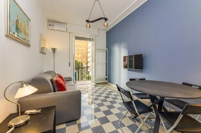 a living room with a couch and a table at Giuliana Apartment Vatican in Rome
