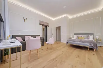 a bedroom with a bed and a couch at Cozy new flat near the Station! in Rome