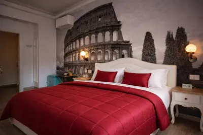 a bedroom with a large bed with the coliseum at RomAntic Dreams Guest House in Rome