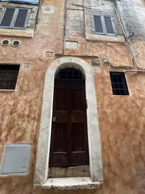 a brown building with a brown door and windows at Navona Fox House 1 in Rome