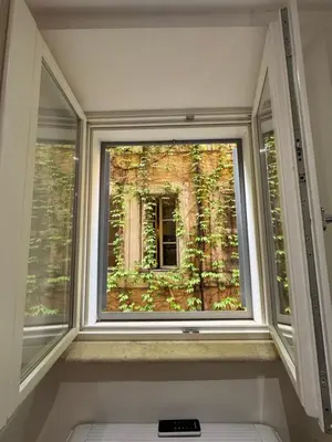 a window with a view of a building at Navona Fox House 1 in Rome