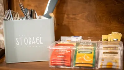a table with a container of food and a box of cheese at Domus Oro nel cuore di Roma in Rome