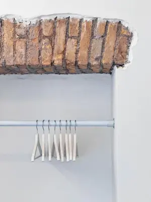 a sign hanging from a pole with utensils at Carlo Alberto Suite in Rome
