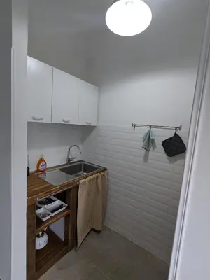 a small kitchen with a sink and a counter at Isolina 63 in Rome