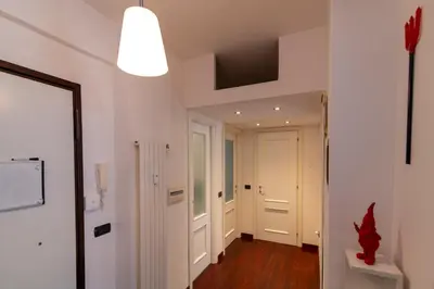 a flat screen tv sitting on a desk in a kitchen at Apartment Marconi 2833 in Rome