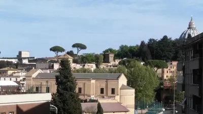 a view of a city with buildings and a dome at Rome Inn Vatican View Rooms in Rome
